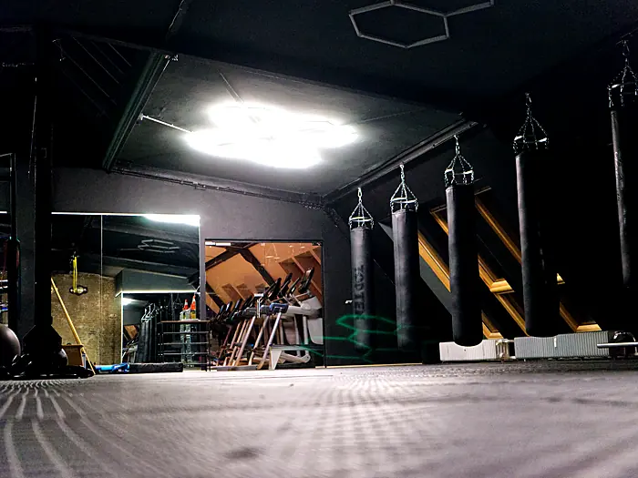 Kickboxing and boxing area with punching bags at Lokahi Loft Berlin